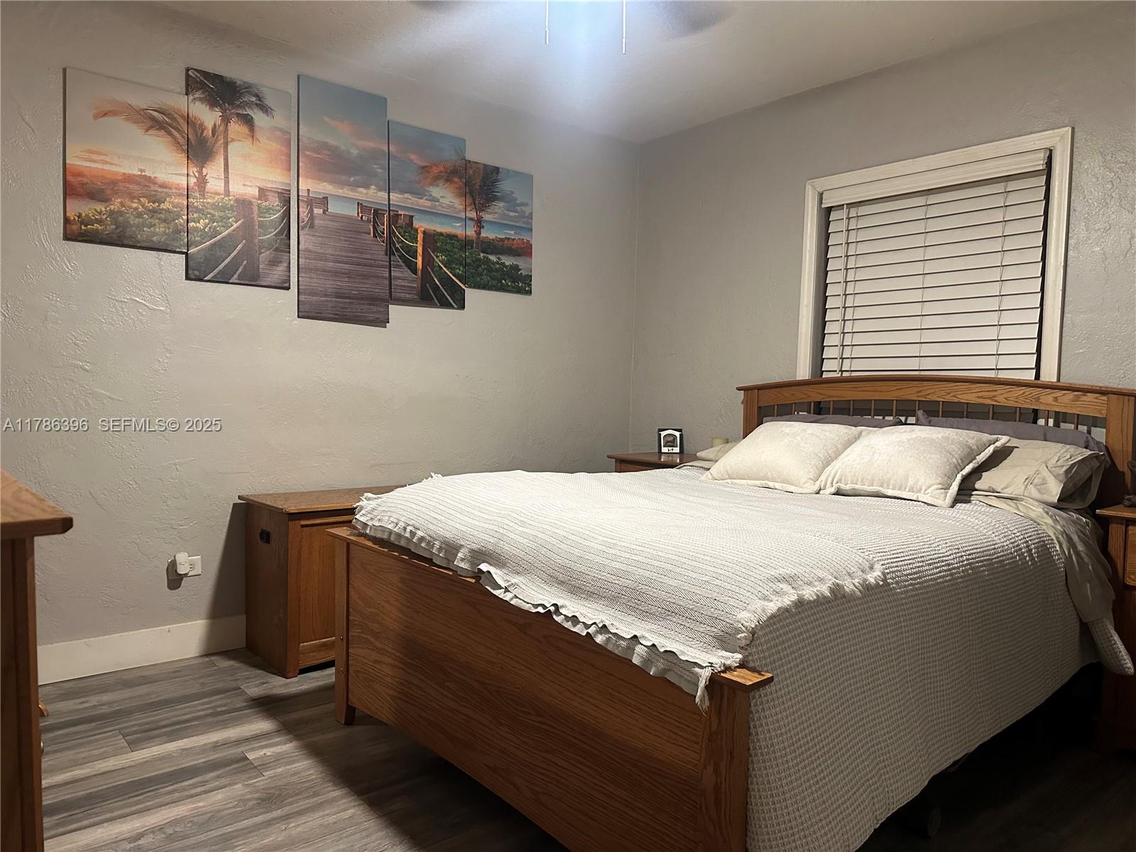 29035 Maine Road Homestead, FL 33033 - Photo 29 of 55 a bed sitting in a bedroom next to a window