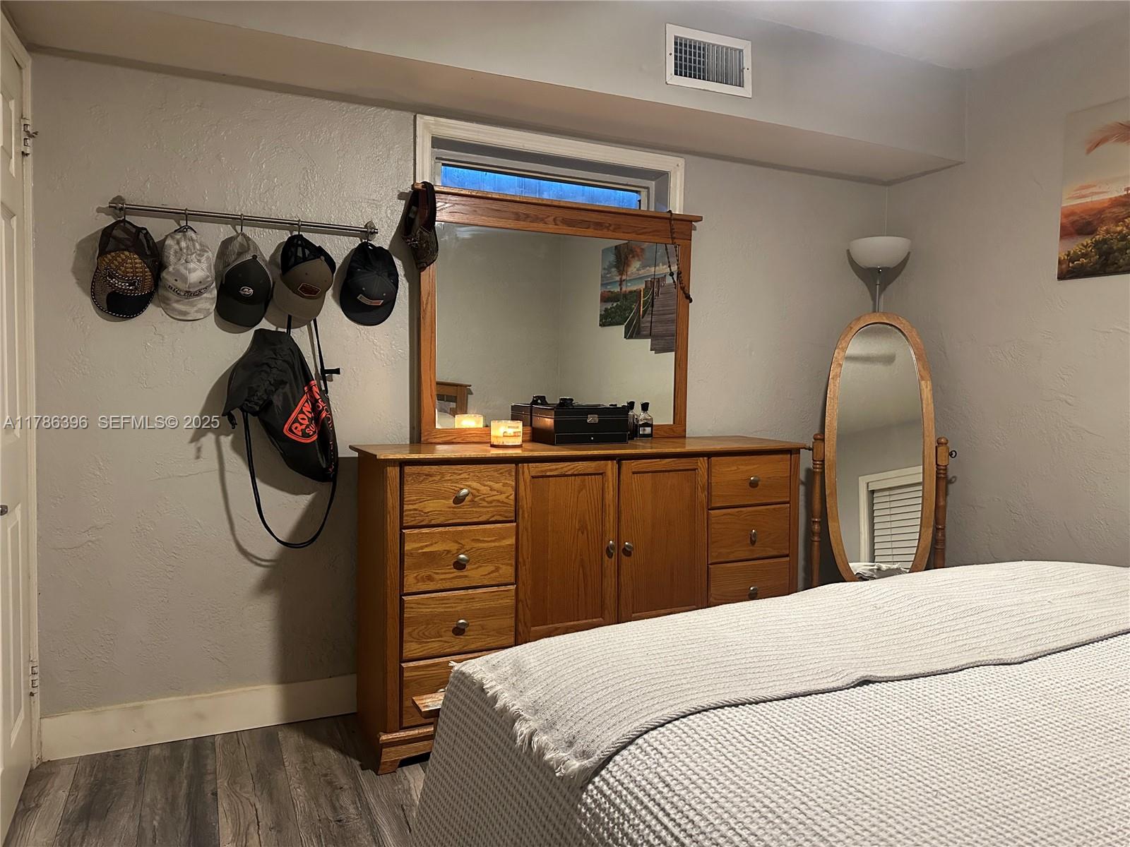 29035 Maine Road Homestead, FL 33033 - Photo 30 of 55 a bedroom with a bed and cabinets