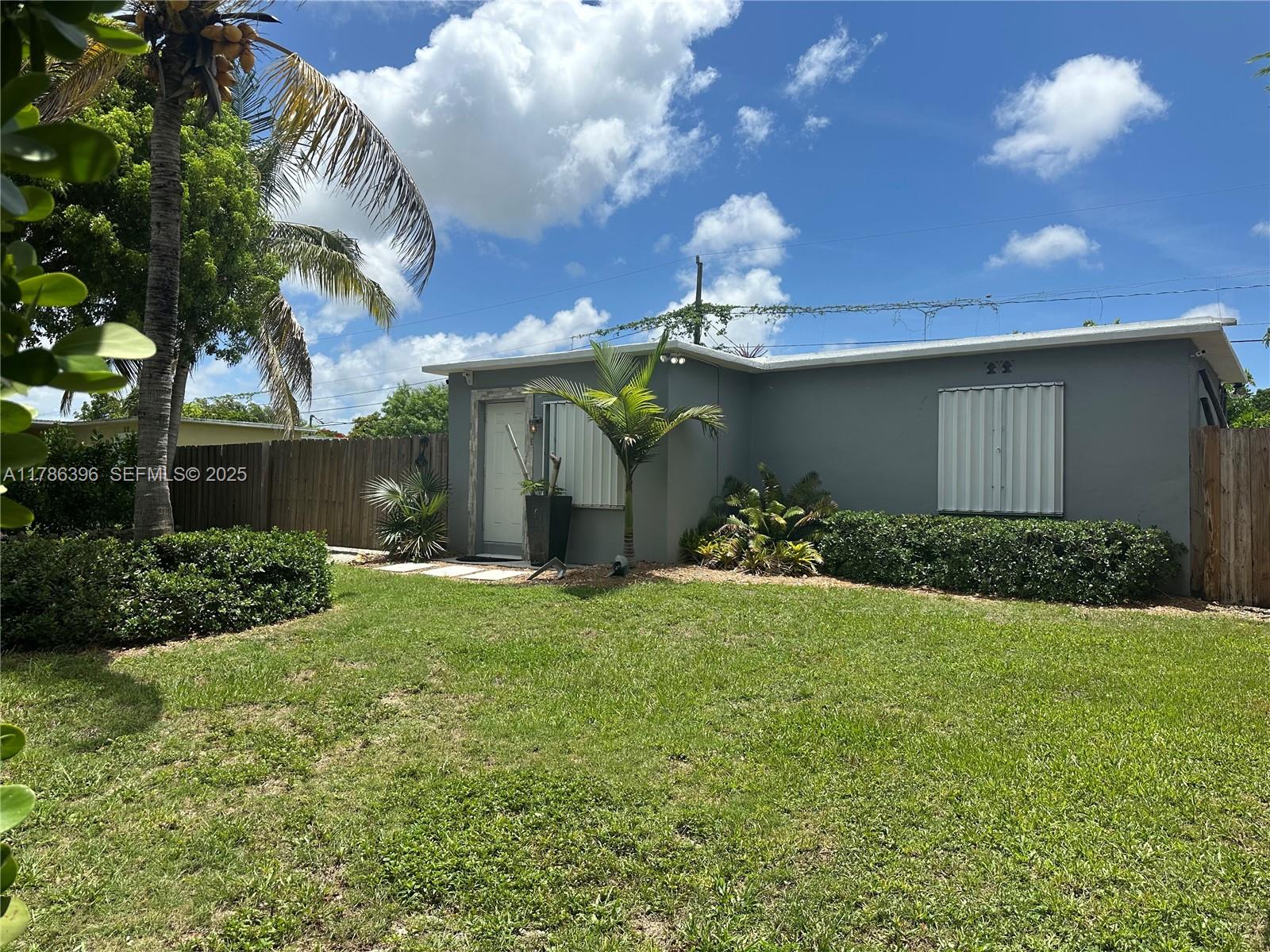 29035 Maine Road Homestead, FL 33033 - Photo 45 of 55 a view of a house with a yard and garage