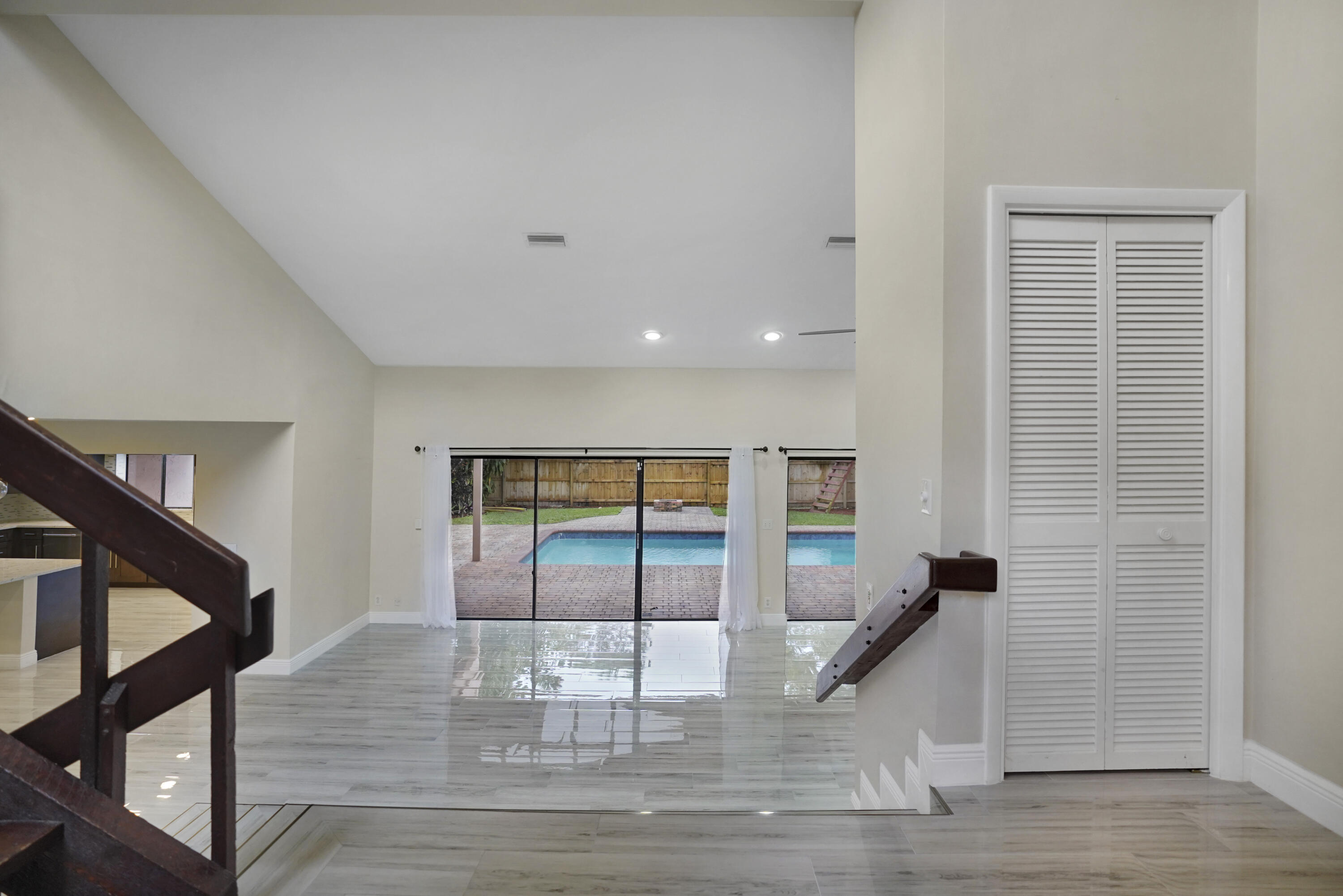2674 Northwest 41st Street Boca Raton, FL 33434 - Photo 4 of 48 a view of entryway and hall with wooden floor