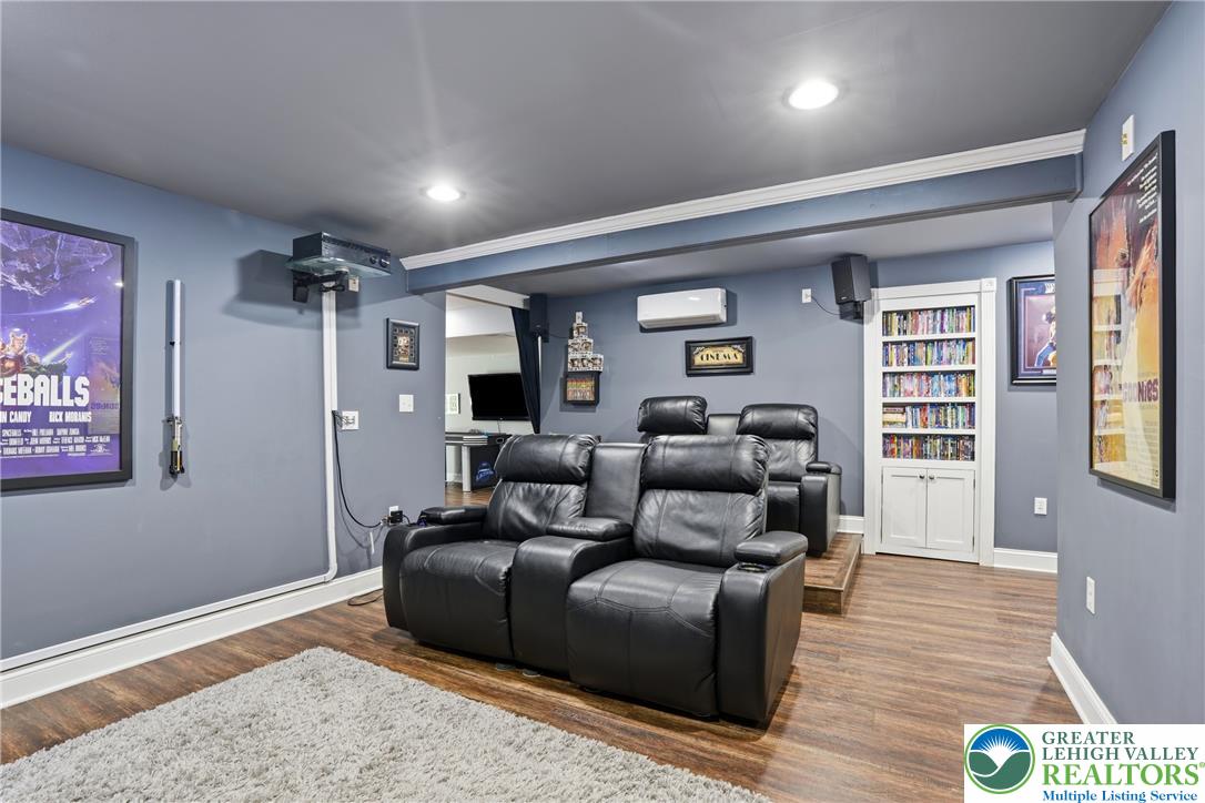 1212 Miller Road Wind Gap, PA 18091 - Photo 52 of 72 An inviting home theater features comfortable seating and built-in shelving for media storage.