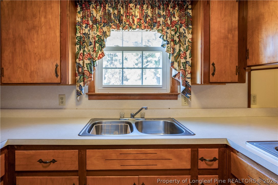 5424 Bonnetsville Road Clinton, NC 28328 - Photo 9 of 29 a view of a kitchen with a sink and cabinets