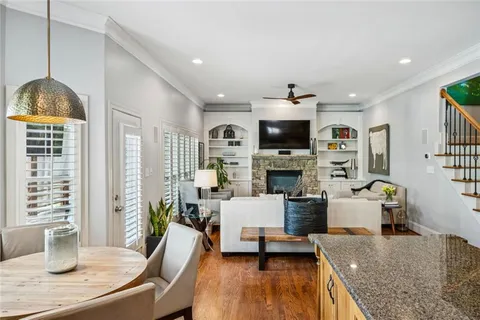 a living room with fireplace furniture and a flat screen tv