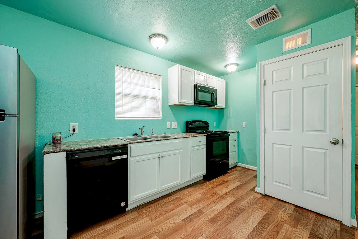 3938 King Street Houston, TX 77026 - Photo 29 of 34 a kitchen with sink cabinets and window