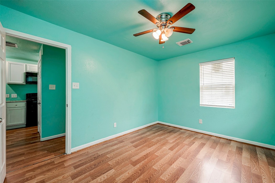 3938 King Street Houston, TX 77026 - Photo 31 of 34 wooden floor in an empty room with a window