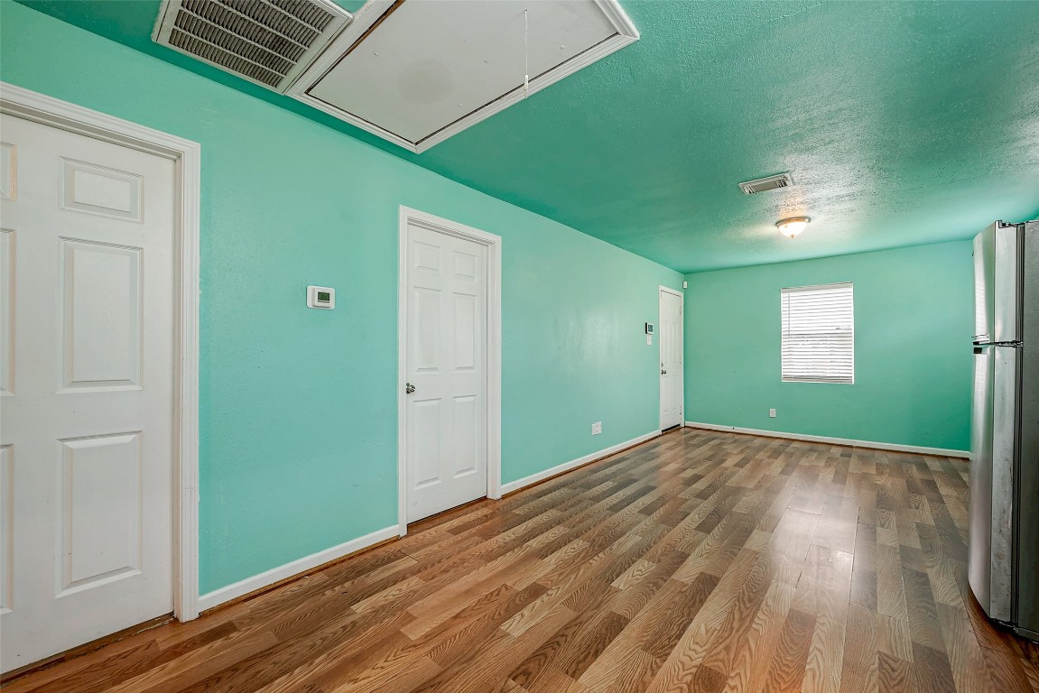 3938 King Street Houston, TX 77026 - Photo 33 of 34 a view of empty room with wooden floor