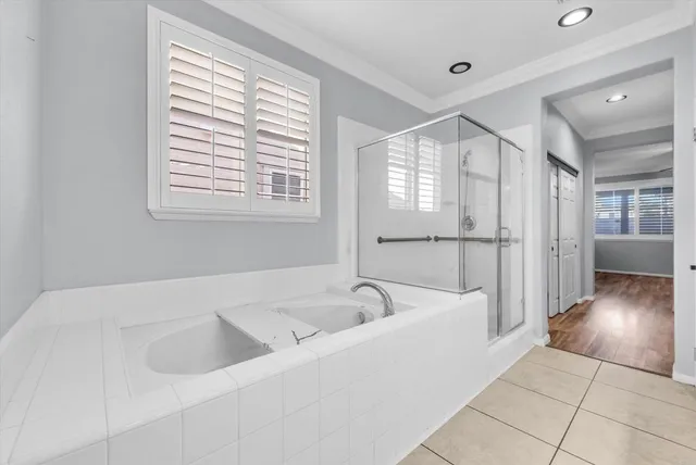 a bathroom with a bathtub and a sink