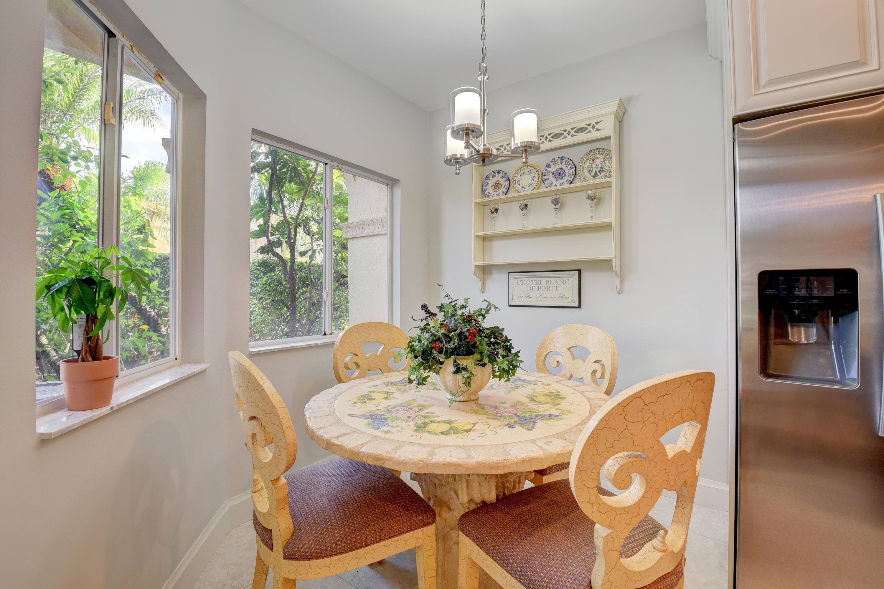 6817 Via Regina Boca Raton, FL 33433 - Photo 17 of 42 a view of a dining room with furniture window and outside view
