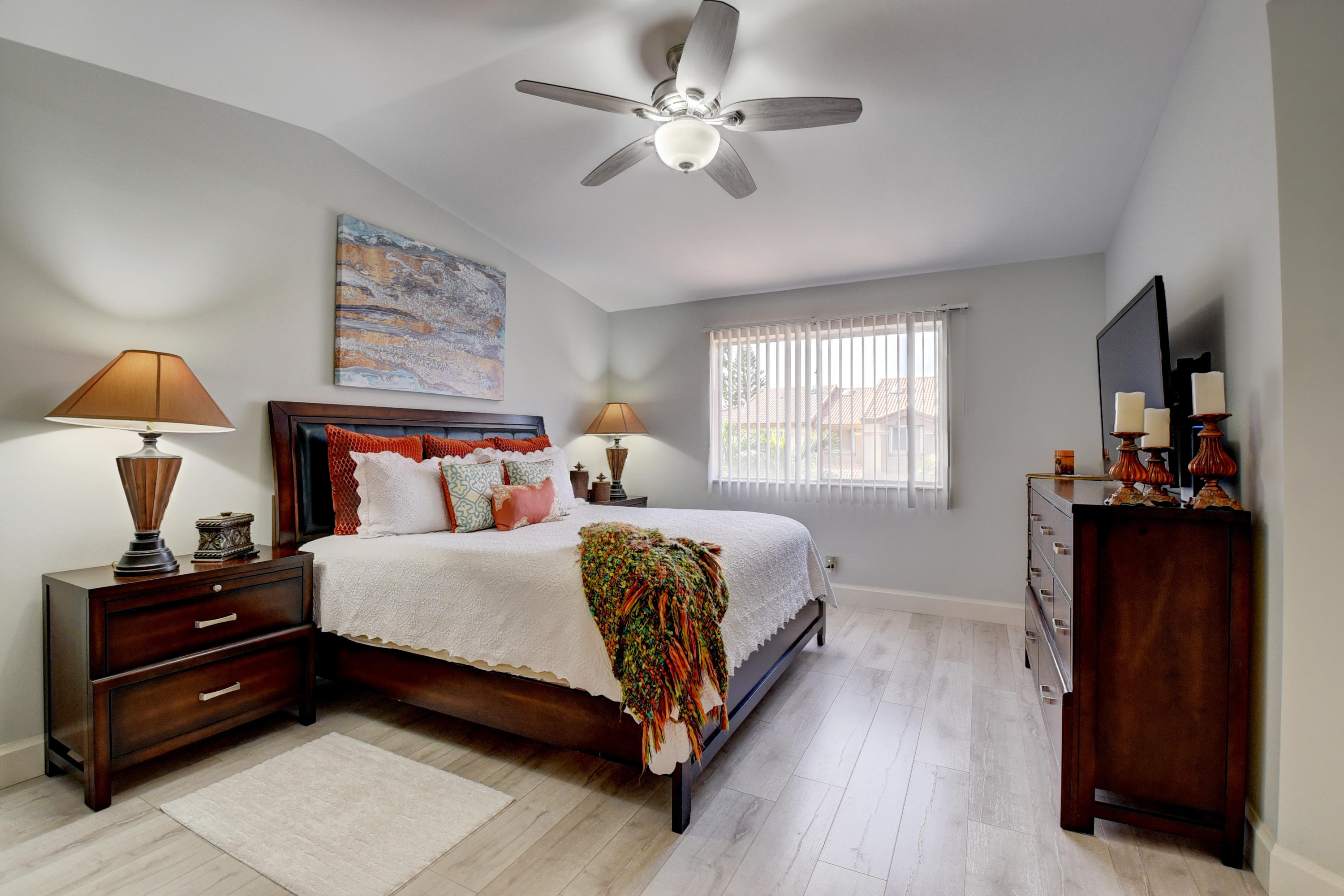 6817 Via Regina Boca Raton, FL 33433 - Photo 20 of 42 a bedroom with a bed and a mirror