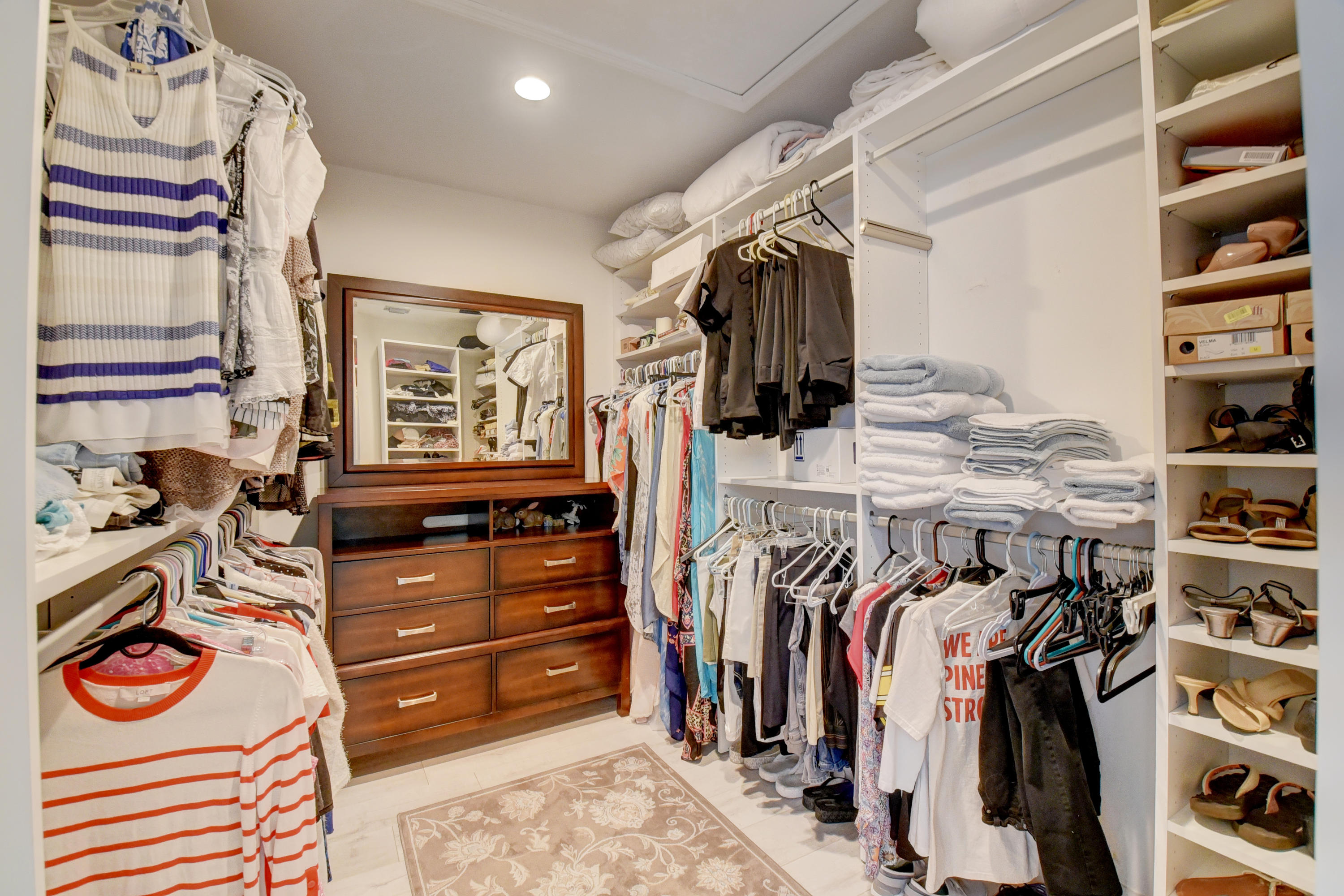 6817 Via Regina Boca Raton, FL 33433 - Photo 24 of 42 a view of walk in closet with clothes and shoes