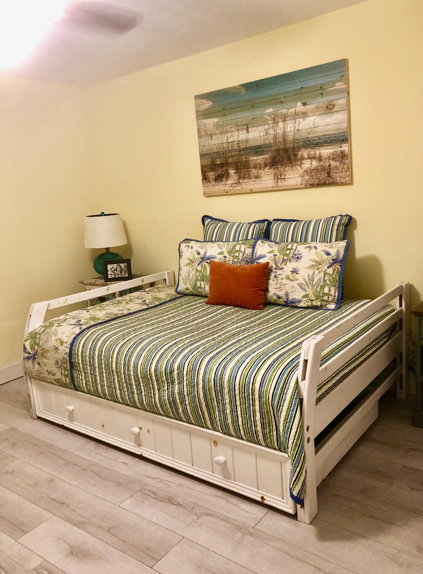 6817 Via Regina Boca Raton, FL 33433 - Photo 26 of 42 a bedroom with a bed and painting on the wall