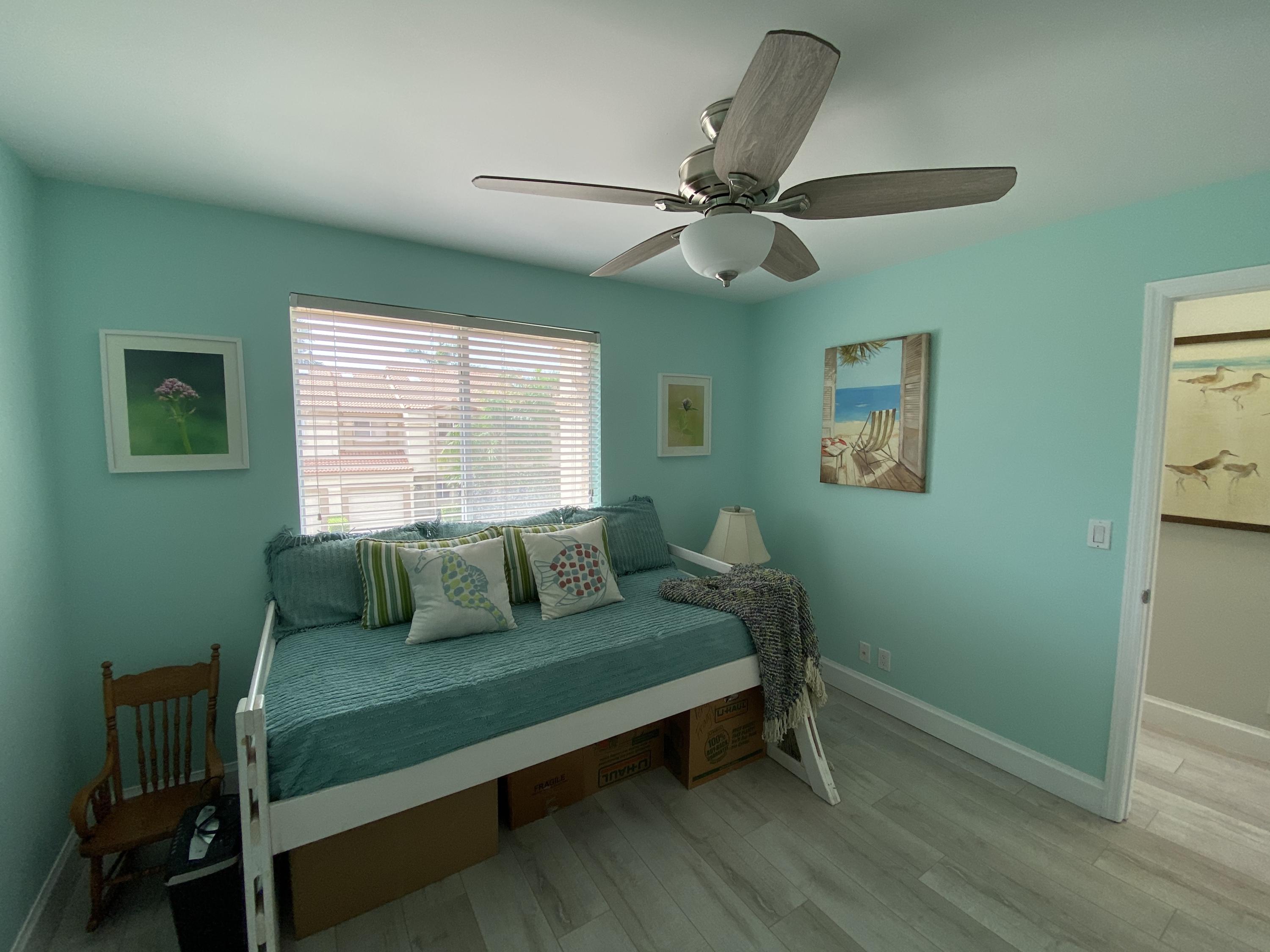 6817 Via Regina Boca Raton, FL 33433 - Photo 33 of 42 a bedroom with a bed and a window