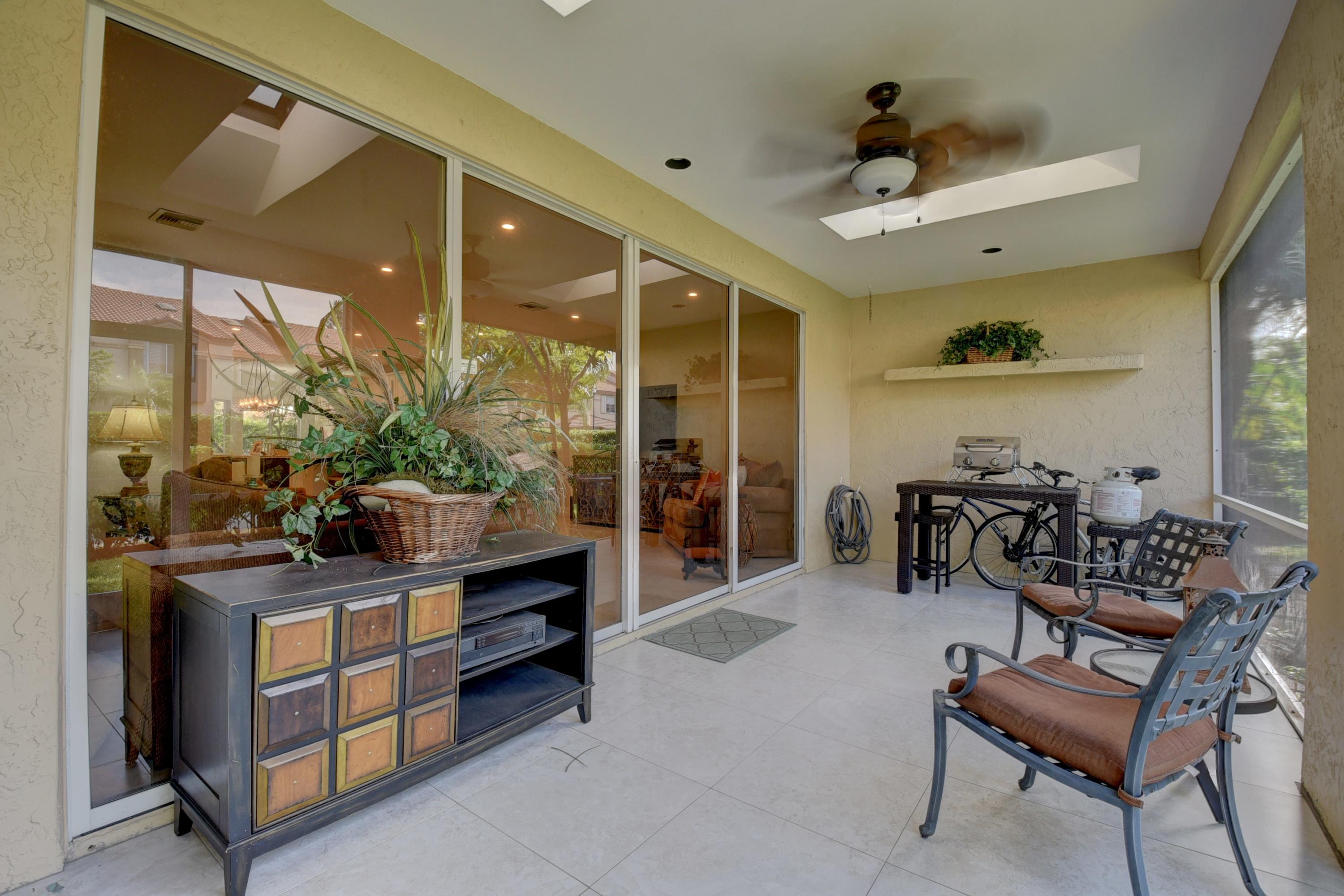 6817 Via Regina Boca Raton, FL 33433 - Photo 37 of 42 a living room with furniture and a potted plant