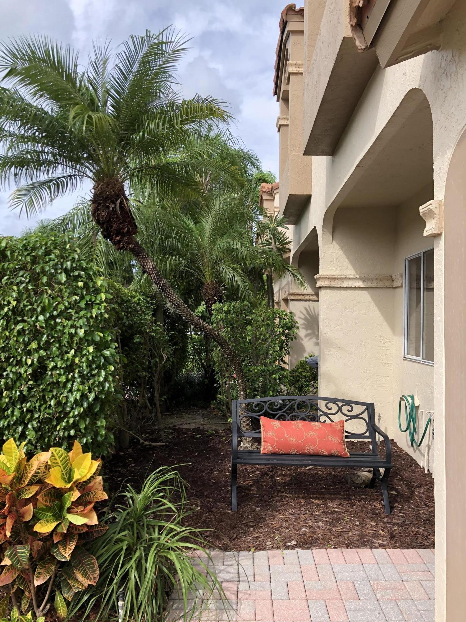6817 Via Regina Boca Raton, FL 33433 - Photo 4 of 42 a view of a pathway of a house with a yard