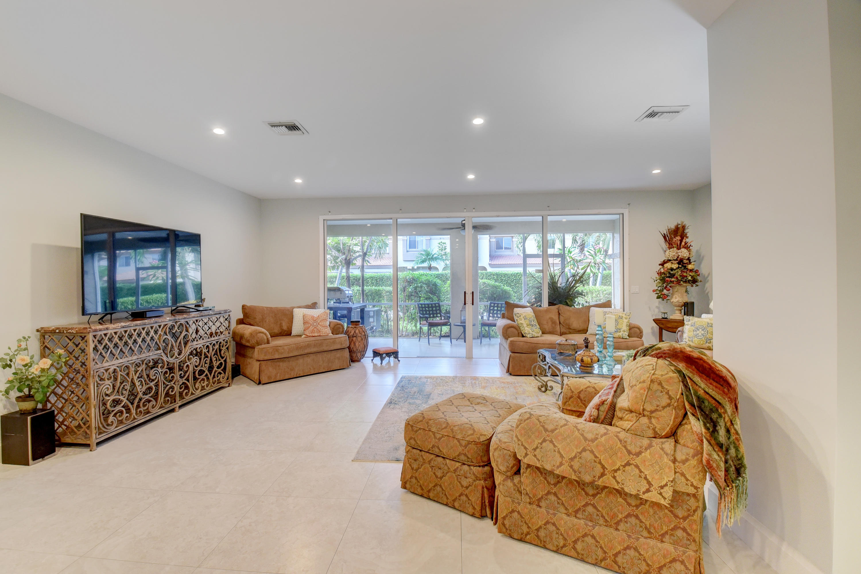 6817 Via Regina Boca Raton, FL 33433 - Photo 9 of 42 a living room with furniture and a large window