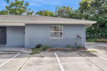 907 Center Avenue, Unit 5 Haines City, FL 33844 - Photo 3 of 15 a front view of a house with a yard