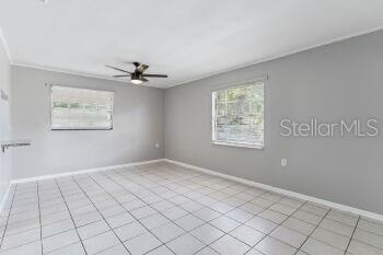 907 Center Avenue, Unit 5 Haines City, FL 33844 - Photo 5 of 15 a view of an empty room with a window