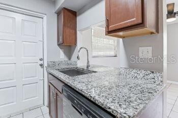 907 Center Avenue, Unit 5 Haines City, FL 33844 - Photo 10 of 15 a kitchen with a sink and cabinets