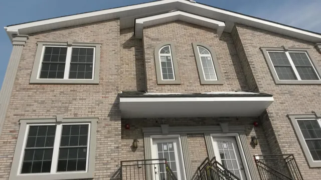 a kitchen with a refrigerator and a stove