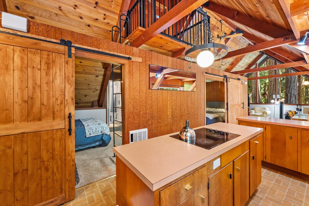 621 Hidden Canyon Watsonville, CA 95076 - Photo 11 of 55 a kitchen that has a lot of fruit on it and wooden floor
