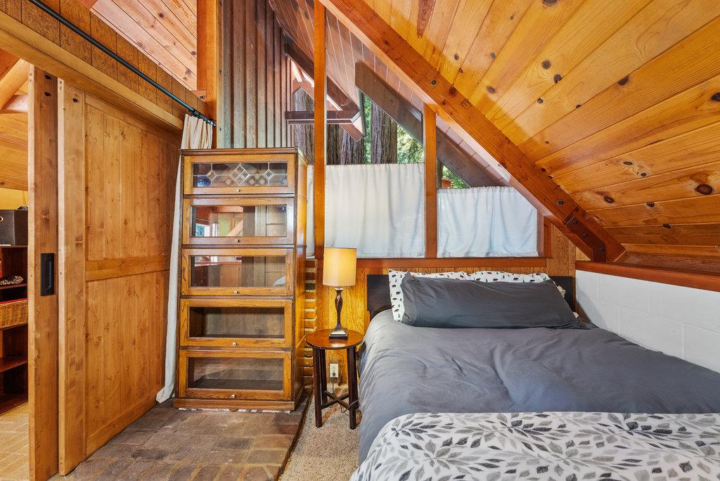 621 Hidden Canyon Watsonville, CA 95076 - Photo 13 of 55 a wooden bench sitting in front of a building