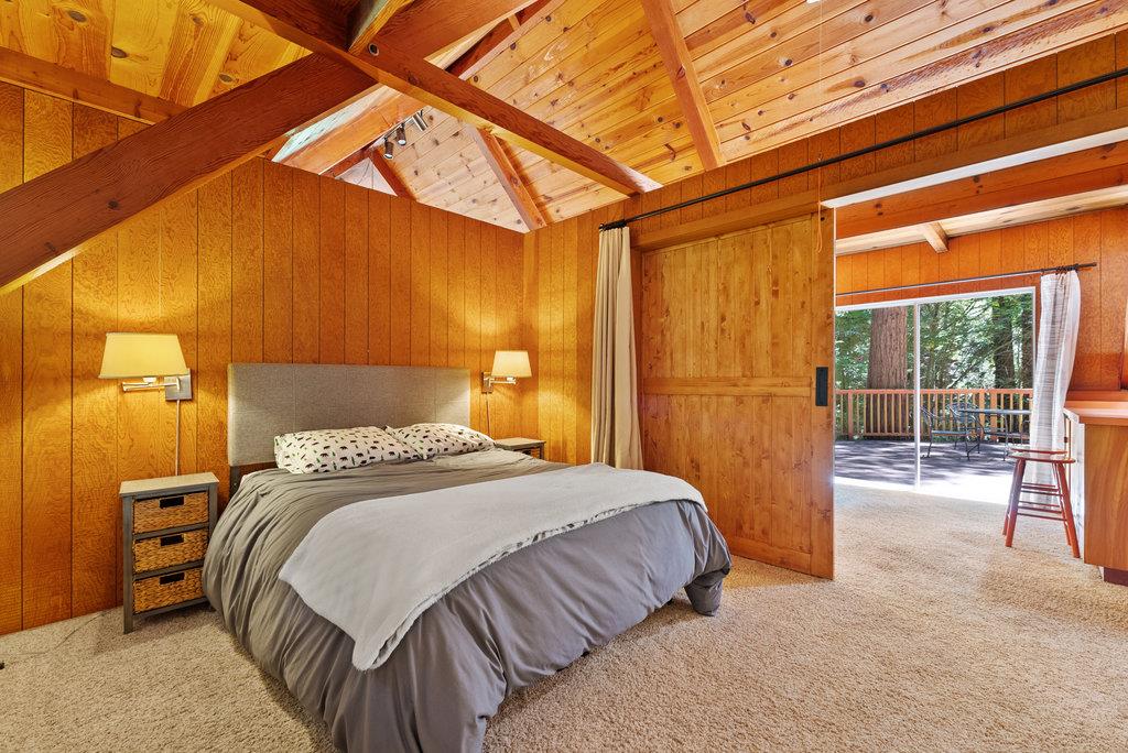 621 Hidden Canyon Watsonville, CA 95076 - Photo 19 of 55 a bedroom with a bed and a large window