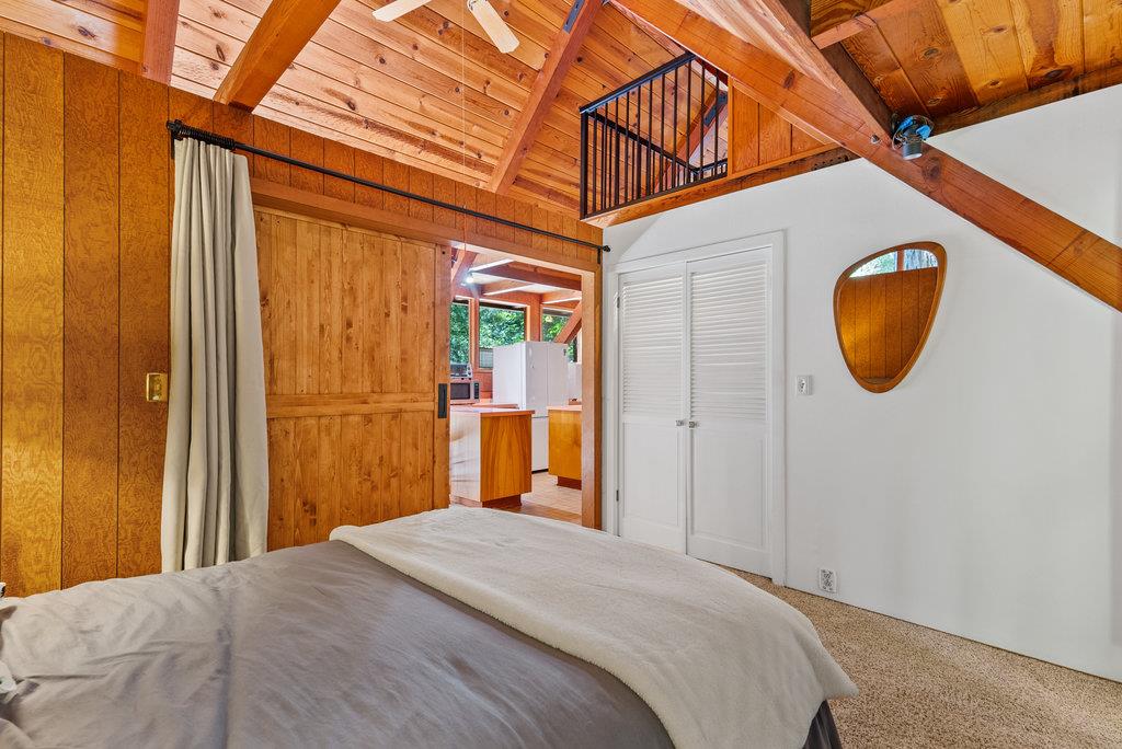 621 Hidden Canyon Watsonville, CA 95076 - Photo 21 of 55 a bedroom with a bed and a mirror