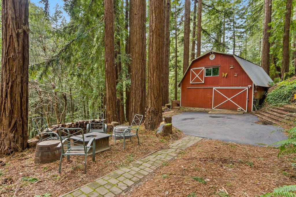 621 Hidden Canyon Watsonville, CA 95076 - Photo 3 of 55 a backyard of a house with table and chairs