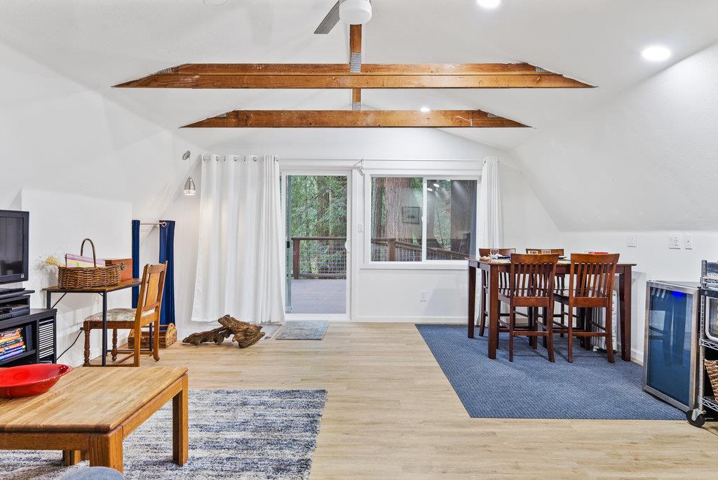 621 Hidden Canyon Watsonville, CA 95076 - Photo 38 of 55 a dining hall with a dining table and chairs with wooden floor
