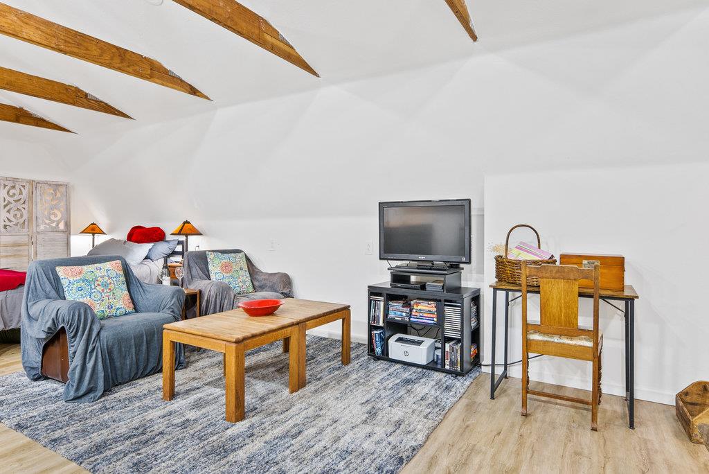 621 Hidden Canyon Watsonville, CA 95076 - Photo 41 of 55 a living room with furniture and a flat screen tv