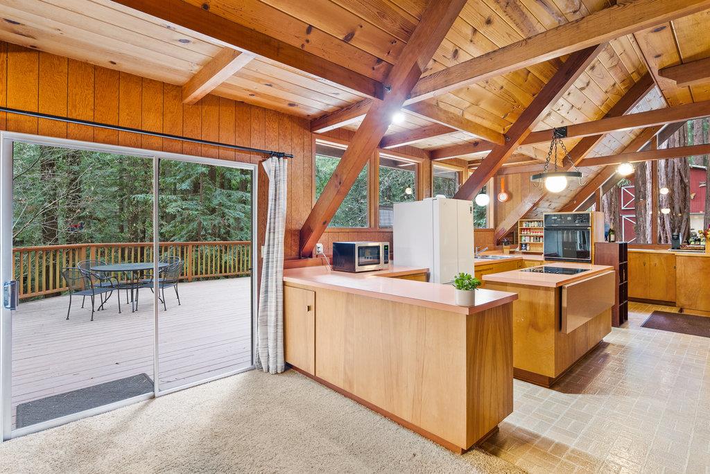 621 Hidden Canyon Watsonville, CA 95076 - Photo 8 of 55 a view of a kitchen with a sink and wooden cabinets