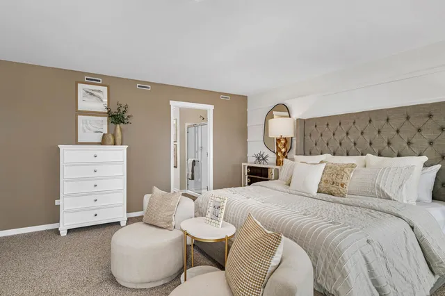 a bedroom with a bed and dresser