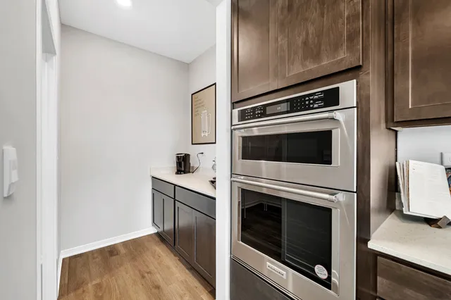 a kitchen with cabinets and steel stainless steel appliances