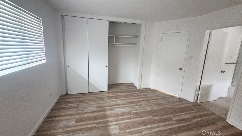 22627 Nadine Circle, Unit B Torrance, CA 90505 - Photo 11 of 16 a view of empty room with wooden floor