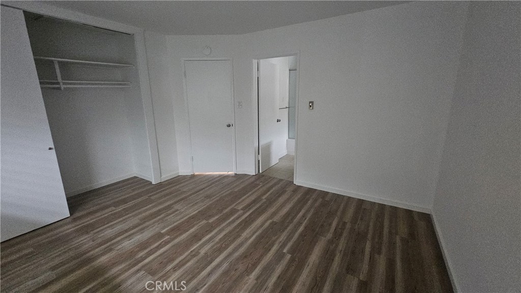 22627 Nadine Circle, Unit B Torrance, CA 90505 - Photo 12 of 16 a view of empty room with wooden floor