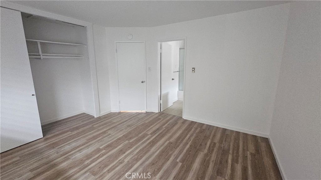 22627 Nadine Circle, Unit B Torrance, CA 90505 - Photo 13 of 16 a view of empty room with wooden floor
