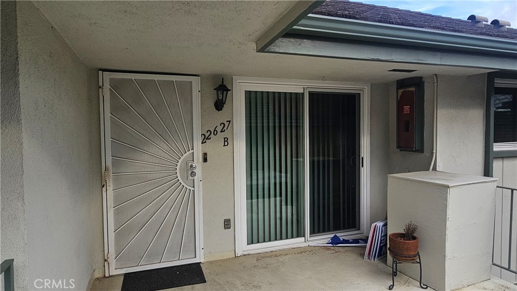 22627 Nadine Circle, Unit B Torrance, CA 90505 - Photo 2 of 16 a view of a house with entryway and wooden walls