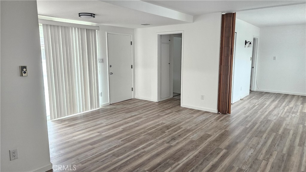 22627 Nadine Circle, Unit B Torrance, CA 90505 - Photo 6 of 16 a view of a room with wooden floor and entryway