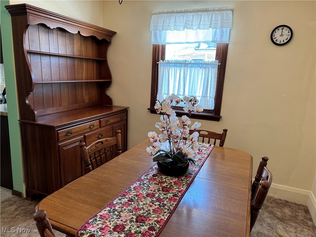 281 Shields Road Youngstown, OH 44512 - Photo 8 of 33 Dining space with carpet floors and baseboards
