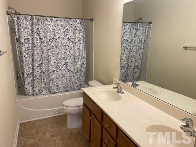 7831 Averette Field Drive Raleigh, NC 27616 - Photo 13 of 20 a bathroom with a sink toilet and shower