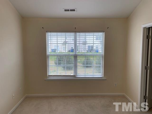 7831 Averette Field Drive Raleigh, NC 27616 - Photo 15 of 20 a view of an empty room with a window