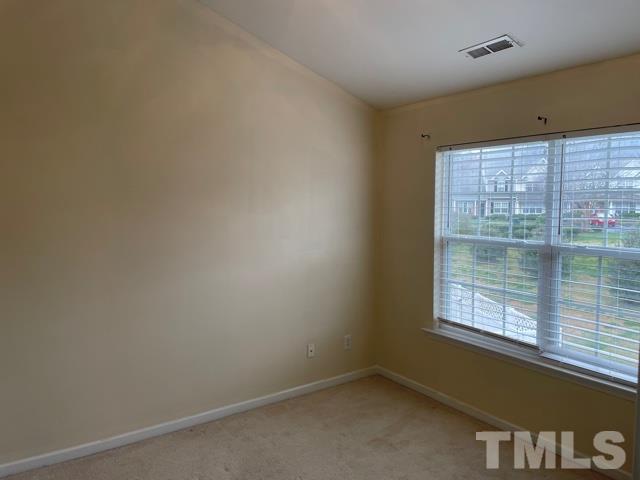 7831 Averette Field Drive Raleigh, NC 27616 - Photo 16 of 20 a view of an empty room with a window
