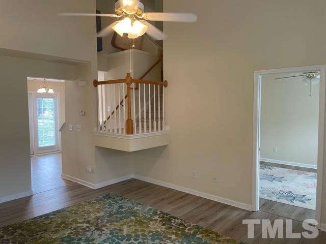 7831 Averette Field Drive Raleigh, NC 27616 - Photo 6 of 20 a view of entryway and hall with wooden floor