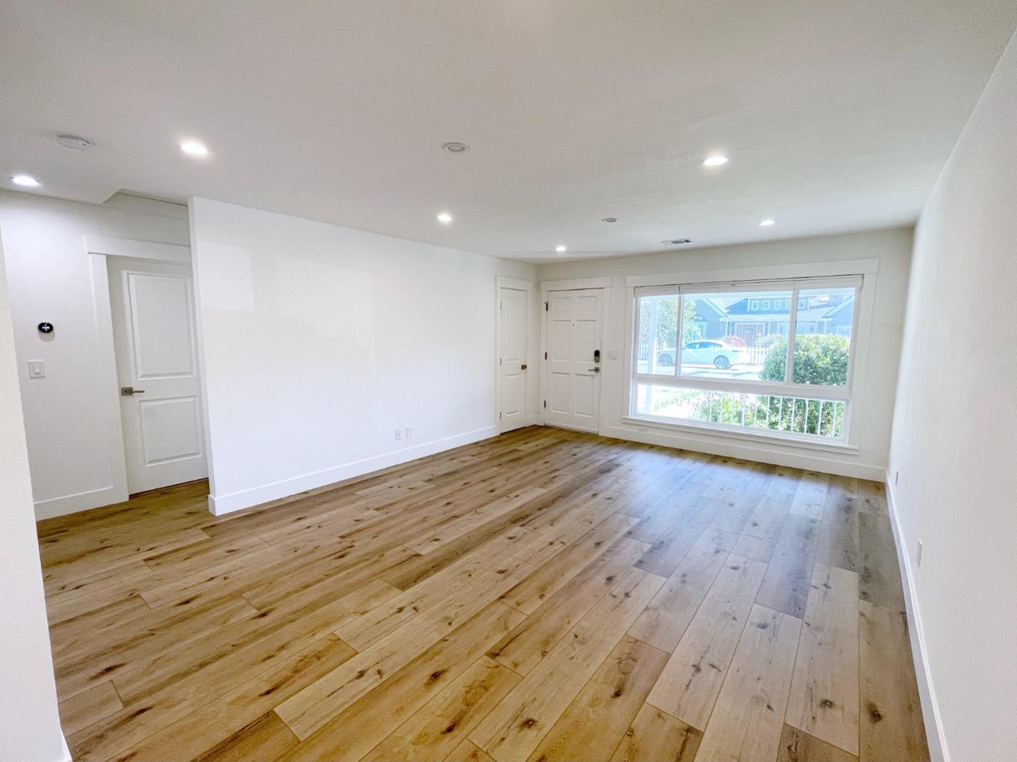 808 Sonia Way Mountain View, CA 94040 - Photo 15 of 20 an empty room with wooden floor and windows