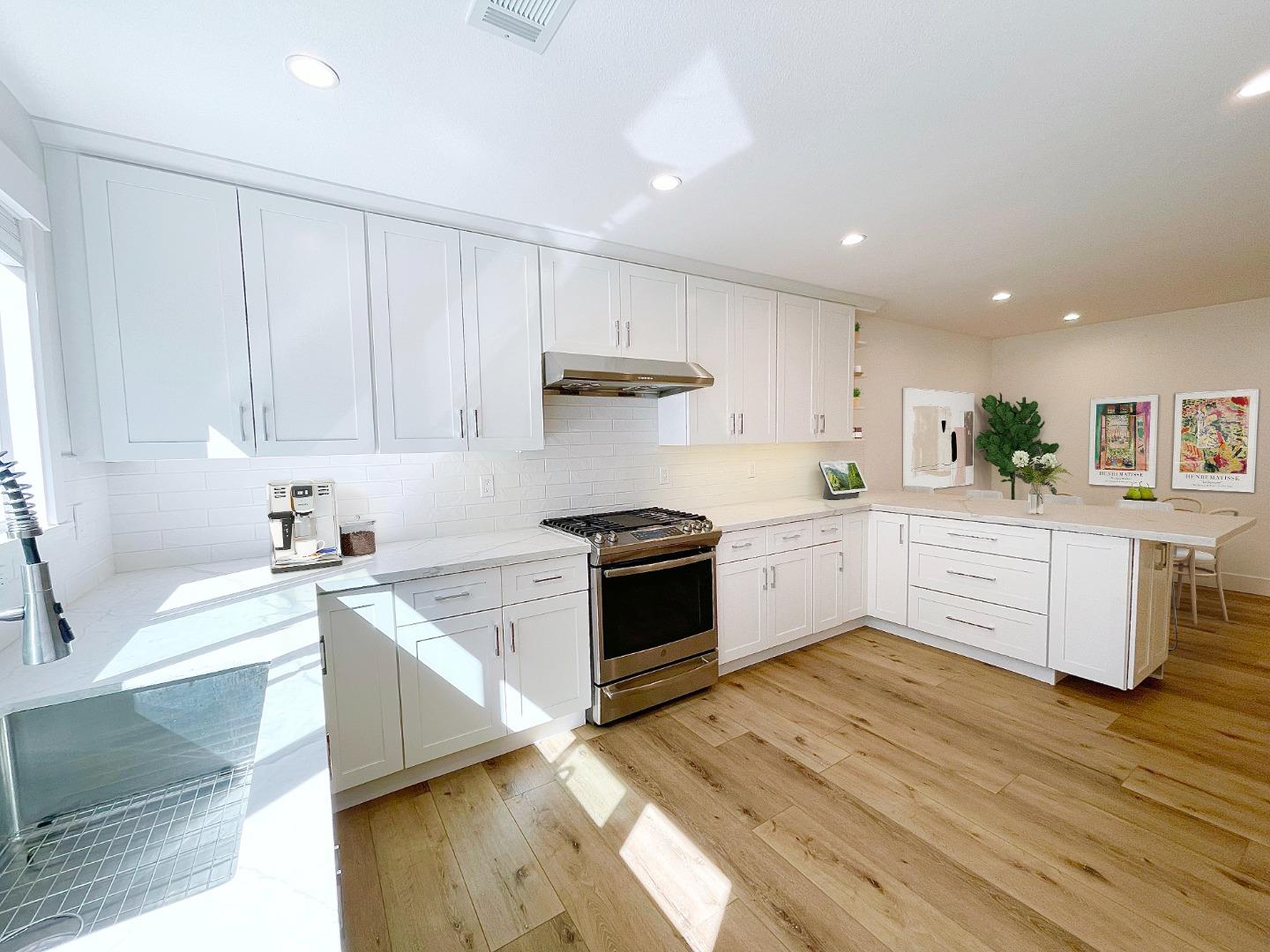808 Sonia Way Mountain View, CA 94040 - Photo 6 of 20 a kitchen with stainless steel appliances granite countertop a stove sink and cabinets