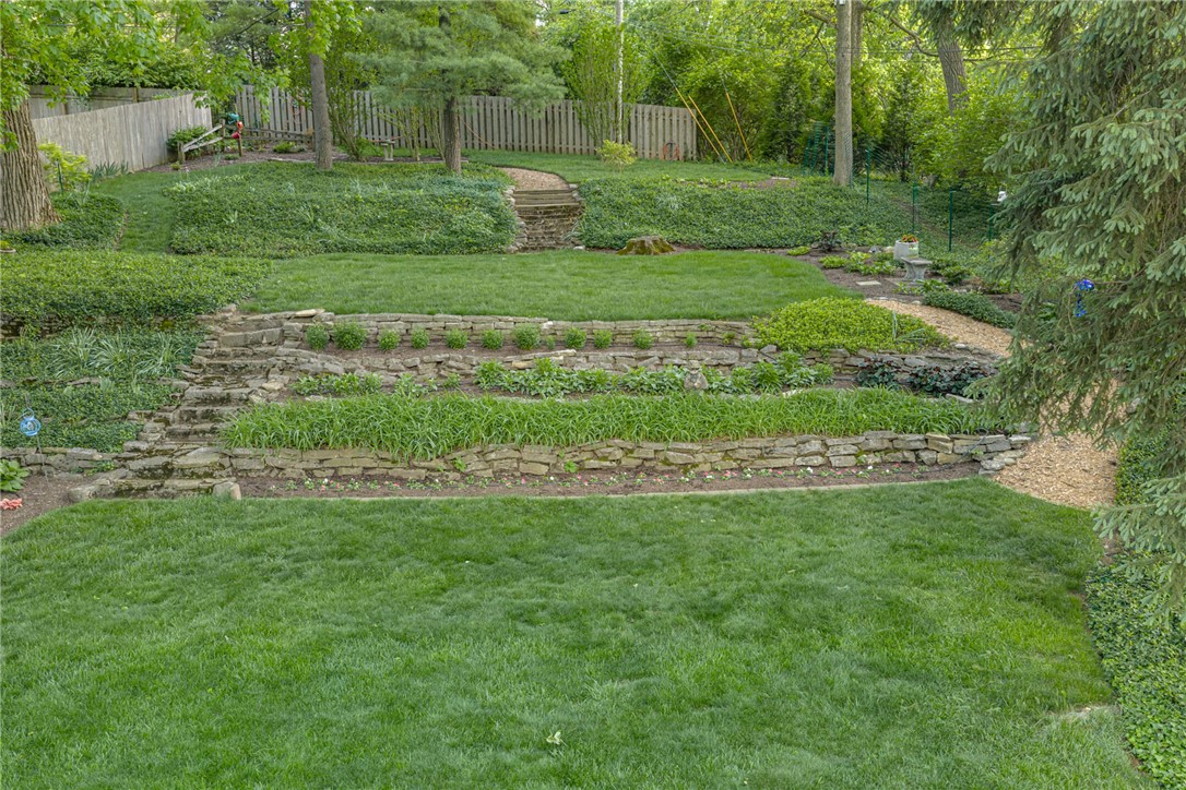 156 West Hadley Road Dayton, OH 45419 - Photo 64 of 71 This verdant outdoor space offers tiered landscaping with lush greenery.
