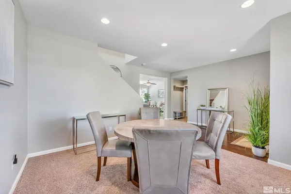 a dining room with furniture and window
