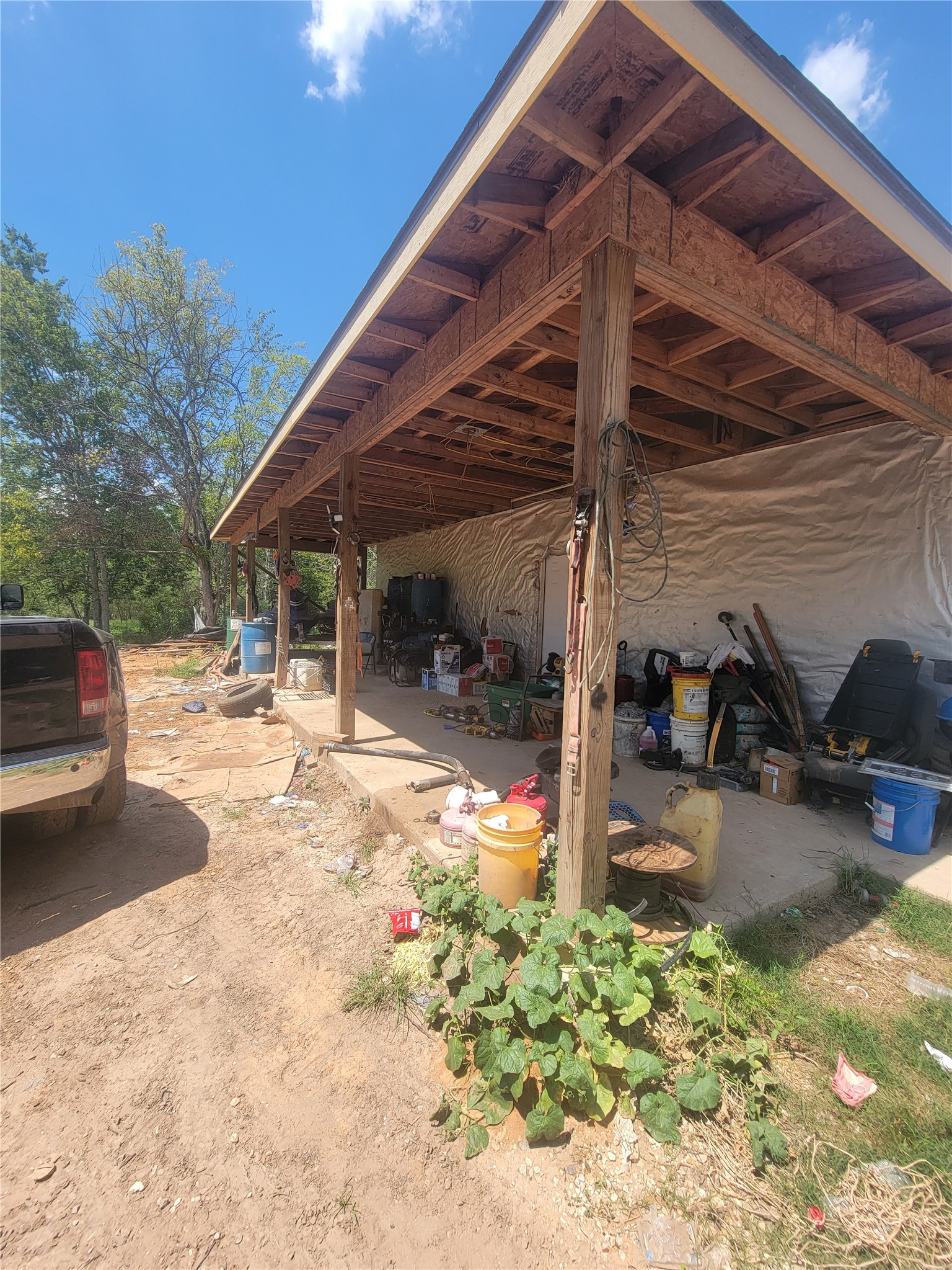 2170 Skrivanek Road Sealy, TX 77474 - Photo 22 of 35 a view of a patio with table and chairs under an umbrella