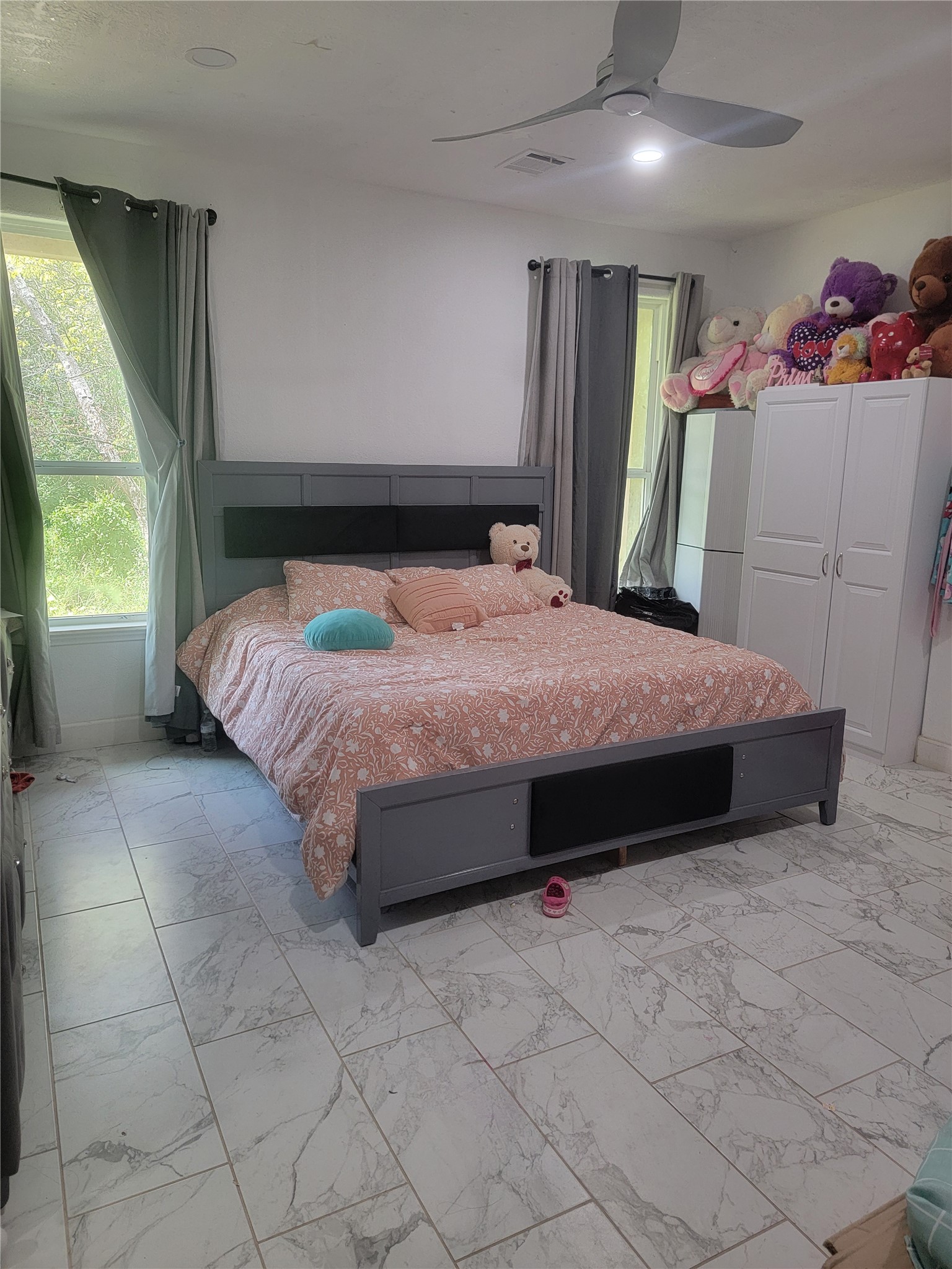 2170 Skrivanek Road Sealy, TX 77474 - Photo 6 of 35 a bed sitting in a bedroom next to a window