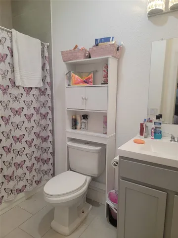 a bathroom with a toilet and a sink